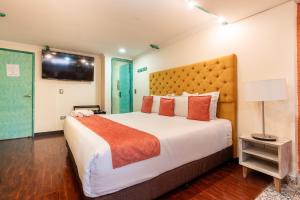 Postel nebo postele na pokoji v ubytování Hotel Casa Antigua