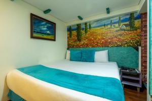 Postel nebo postele na pokoji v ubytování Hotel Casa Antigua