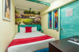 Postel nebo postele na pokoji v ubytování Hotel Casa Antigua