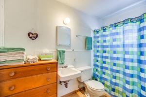 a bathroom with a sink and a toilet and a shower at The Cabins at Cloudcroft in Cloudcroft