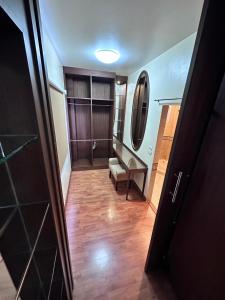 a hallway with a bathroom with a bench and a mirror at KT Villa 963 in Bangkok
