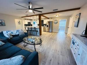 a living room with a blue couch and a table at Sea Turtle Cove in Clearwater