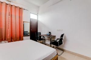 Ένα ή περισσότερα κρεβάτια σε δωμάτιο στο FabHotel Tree view Residency