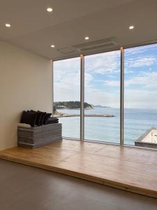 a living room with a view of the ocean at OOU SPACE in Geoje