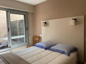 Postel nebo postele na pokoji v ubytování Appartement Saint-Palais-sur-Mer, 2 pièces, 3 personnes - FR-1-539-42