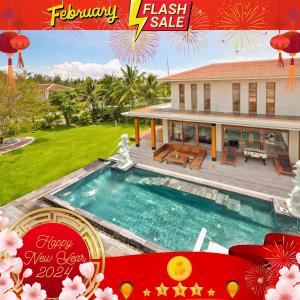 una portada de revista de una casa con piscina en Danang Ocean Resort & Spa Non Nuoc Beach Villas en Da Nang