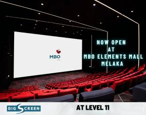 an auditorium with red chairs and a large screen at Attic Home Melaka Silverscape Residence & Jonker in Melaka