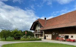 a large building with a brown roof at La Ferme - b48766 