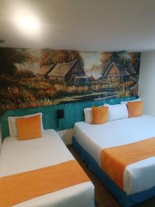 Postel nebo postele na pokoji v ubytování Hotel Casa Antigua
