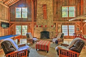 a living room with a pool table and a fireplace at Bear's Eye View - Mountain Retreat w/ Hot Tub! in Acme