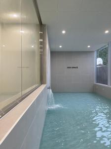 a bath room with a pool of water at OOU SPACE in Geoje