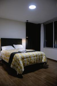 Ένα ή περισσότερα κρεβάτια σε δωμάτιο στο PRANA