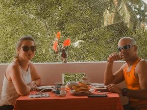 a man and a woman sitting at a table at Summer lodge-Tangalle in Tangalle