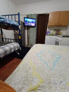 a bedroom with a bunk bed with a map on it at Alojamiento chillan in Chillán