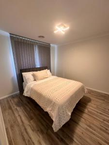 Ένα ή περισσότερα κρεβάτια σε δωμάτιο στο Canberra 3 Bedroom home to remember