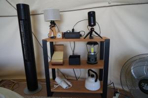 a shelf with a blender and a lamp on it at ASOBI HACK 