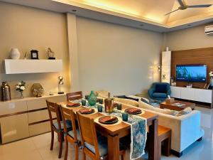 a living room with a table and a couch at Villa Tara nr Layan Beach in Bang Tao Beach +20 photos