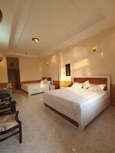 Ένα ή περισσότερα κρεβάτια σε δωμάτιο στο Green Hill Guest House