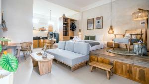a bedroom with a bed and a living room at Alaya Homes B - Stylish Japandi Loft Suite in Seminyak in Seminyak