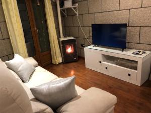 TV a/nebo společenská místnost v ubytování Apartamento Cervantes - Piedad Fernandez Fernandez Gestión de Inmuebles SL