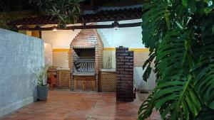 a patio with an outdoor oven in a house at Céntrico Monoambiente con Parrillero Privado in Tarija