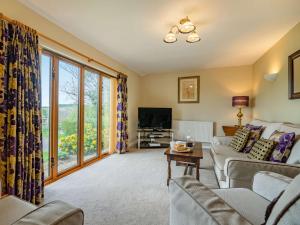 a living room with a couch and a tv at 2 bed in Hadleigh 87956 