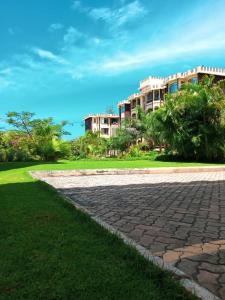 a brick walkway in front of a building at Lux Suites Sunset Furnished Apartments in Mombasa