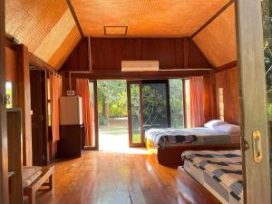 Postel nebo postele na pokoji v ubytování Pai Kiniman Resort