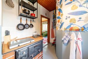 a kitchen with a sink and a refrigerator at Grannys cottage in Laihia