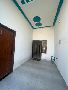 an empty room with a door and a ceiling at Grewal homestay in Jalandhar