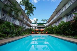 a swimming pool in the middle of a building at Pacific Marina Inn in Honolulu