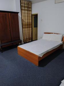 a bedroom with a bed and a dresser at Aurora Echo Villa in Matara