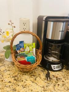a basket sitting next to a coffee maker at Peace and love house in Santa Cruz