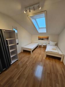 a bedroom with a bed and a skylight at Ach18, Bregenz, Vorarlberg Apartments in Bregenz