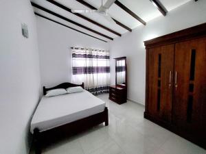 Postel nebo postele na pokoji v ubytování Comfortable Stay in Colombo