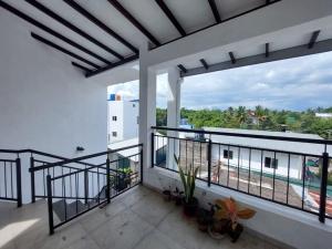 a balcony with a view of a building at Comfortable Stay in Colombo in Rajagiriya