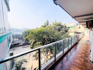 a balcony with a view of a river at The Nizamuddin palace in New Delhi