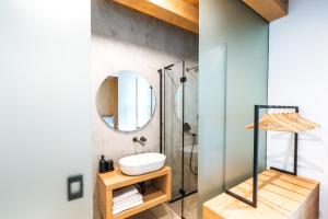 a bathroom with a sink and a shower at Aparthouse Lubno in Frýdlant nad Ostravicí +58 photos