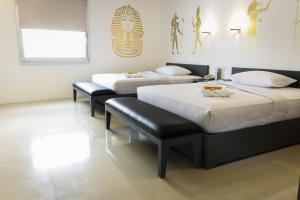 Letto o letti in una camera di GC Suites