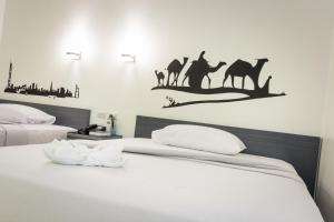 Letto o letti in una camera di GC Suites