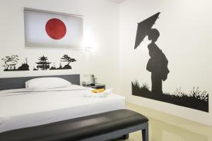 Letto o letti in una camera di GC Suites