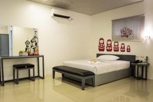 Letto o letti in una camera di GC Suites