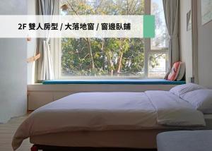 Katil atau katil-katil dalam bilik di 東海小時光 Tong Hai Time Homestay