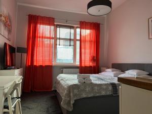 Posteľ alebo postele v izbe v ubytovaní VULTOR Apartments