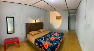 Postel nebo postele na pokoji v ubytování Bungalow Karo Hill