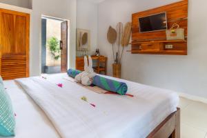 Letto o letti in una camera di Bale Sampan Boutique Bungalows