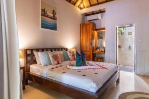 Letto o letti in una camera di Bale Sampan Boutique Bungalows
