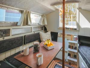 a kitchen with a table with a bowl of fruit on it at Chere Amie-qu7616 in Melton Constable