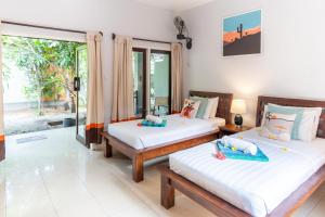 Letto o letti in una camera di Bale Sampan Boutique Bungalows