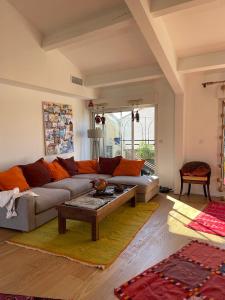 a living room with a couch and a coffee table at Colourful loft in Marseille in Marseille